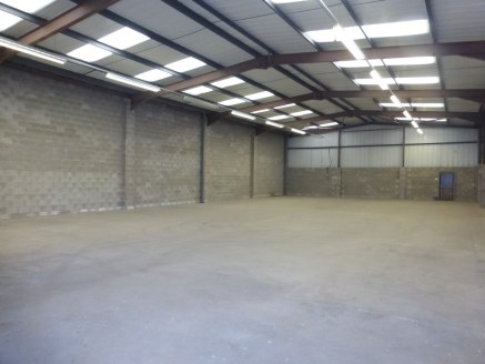 The unit is an end single terrace bay industrial unit of steel portal frame construction with brick infill and part brick an profile metal sheet cladding, with a pitched lined roof incorporating translucent lights. The unit benefits from forecourt ca...