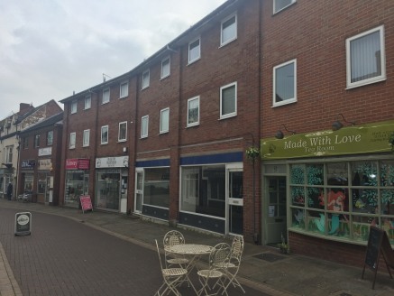 The property is situated in a secondary trading position in Rugeley town centre on the south side of Bow Street between its junctions with Market Square and Elmore Lane.<br>The property forms part of a three-storey building of brick and tile construc...