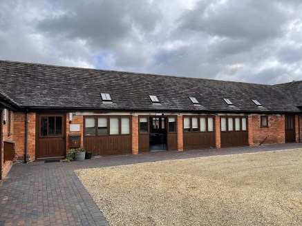 Patrick Farm Barns are a mixture of single- and two-storey brick and tile buildings arranged in two linked courtyards. The barns are believed to date from the early 1800s. An 18th century farmhouse and adjacent more modern buildings serve the continu...