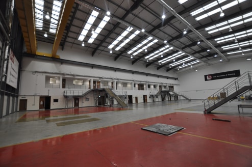 * Ground floor warehouse on secure facility

* Allocated car parking

* To be completely refurbished

* Previously used as aircraft simulator hall