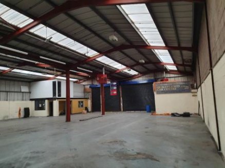 The property comprises of a single storey, two bay warehouse of steel portal frame construction surmounted by a pitched insulated roof incorporating translucent roof lights.\n\nThe property benefits from two large roller shutter entry doors (4.96m x...