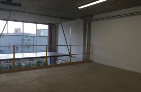 Self-contained studio/office unit arranged as open plan accommodation over ground floor and mezzanine levels. The unit has been finished to a good decorative order with white wash walls, painted concrete floor, recessed lighting and 3 phase power as...