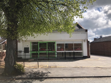 The property comprises a brick built single storey stand alone former convenience store with full glazed frontage. Internally the property comprises a large open plan sales/showroom area with separate storage, office, kitchen, w/c and loading to the...