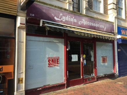 The property comprises a lock-up shop forming part of a parade of shops leading to the seafront from the pedestrianised retail section of the town. The property benefits from fluorescent lighting, rear access, rear store and W.C.