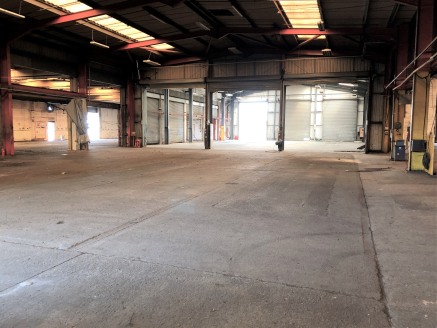 Unit A comprises a detached light industrial/workshop unit constructed of brick elevations surrounding a steel portal frame beneath a mono pitched roof. The property has 3 inspection pits for haulage vehicles. Access is via three full height loading...