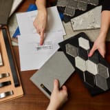 Designer showing samples to customer