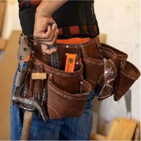 Tool Belts: A person wearing a tool belt reaches for a tool. Their belt is leather with many pouches.