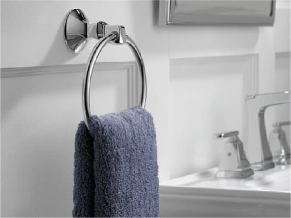 Delta Hand Towel Holder holding a blue towel