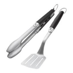  A stainless steel spatula and pair of tongs with black non-slip grips. Each features a very small Weber grills logo.