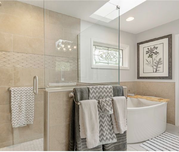 The large vanity with double sinks and white cabinets.