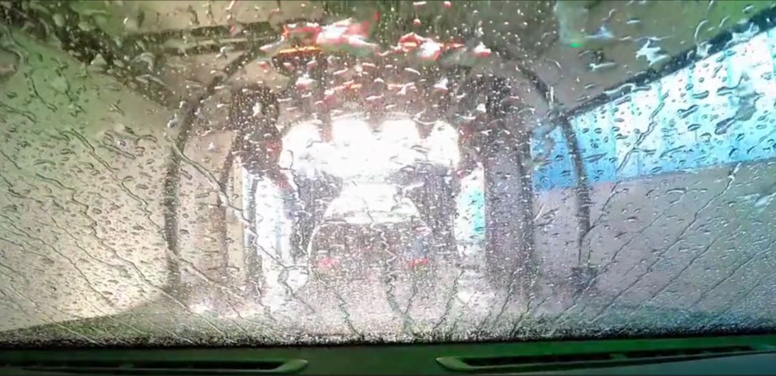 Go and Glow - Front View of Car through Car Wash