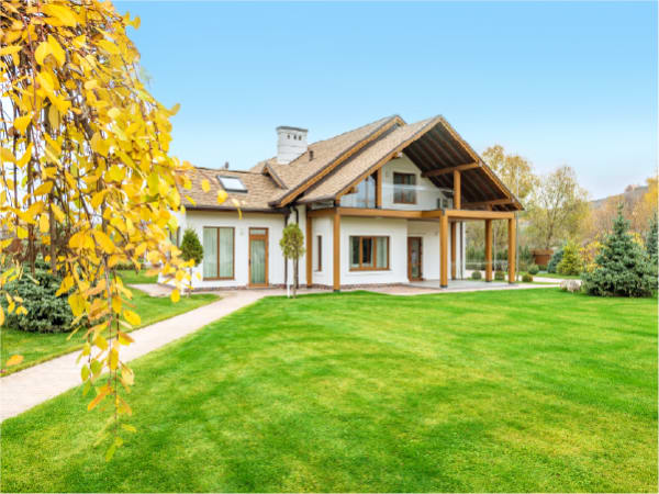 Residential home with a sunny, green lawn