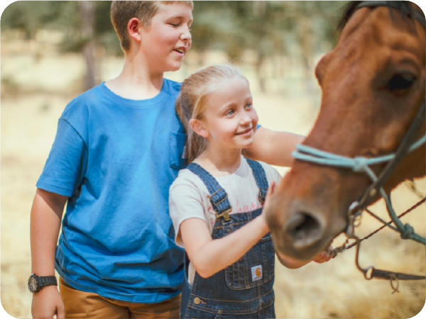 Brother and sister wearing Carhartt apparel