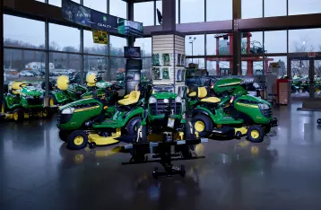 The John Deere equipment showfloor in the Outdoor Power department at Hartville Hardware with special financing overlay.