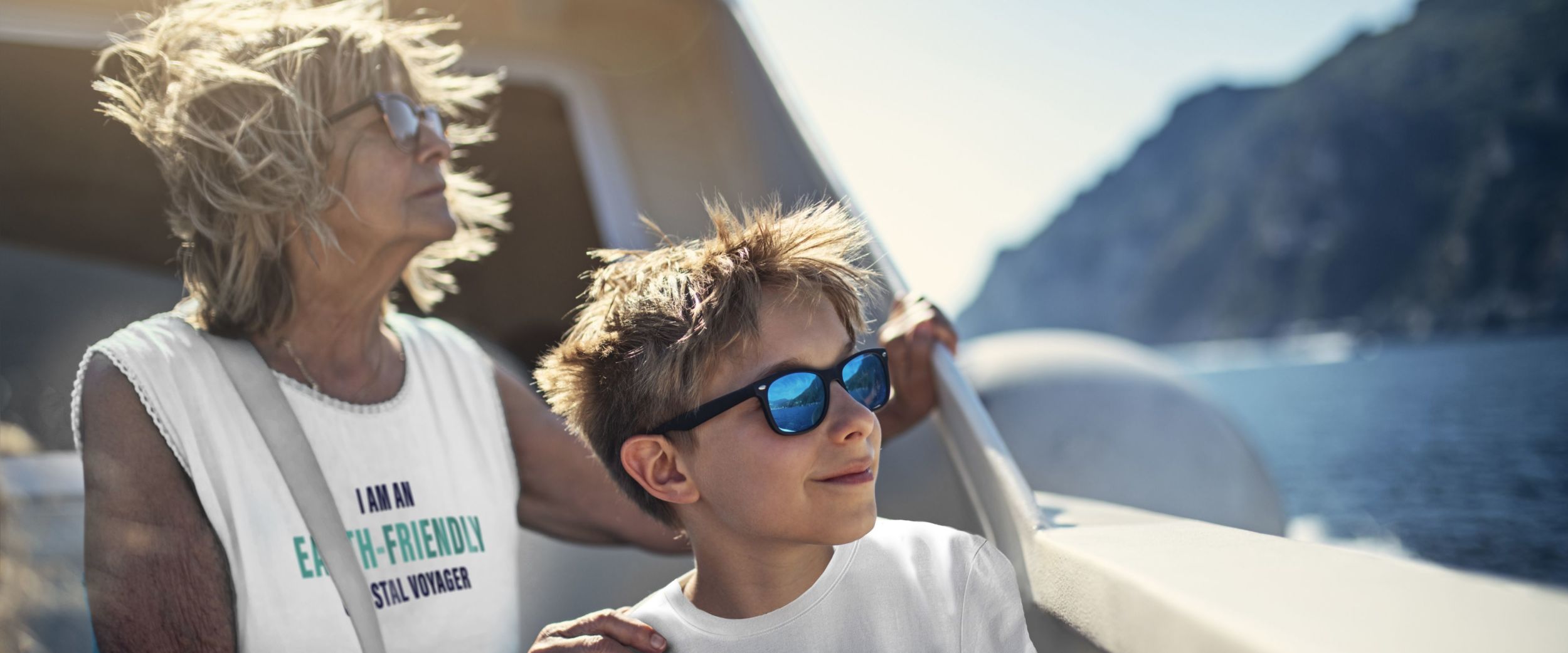 Grandma and grandchildren with earth-friendly coastal voyager t-shirts. Getty/Havila.