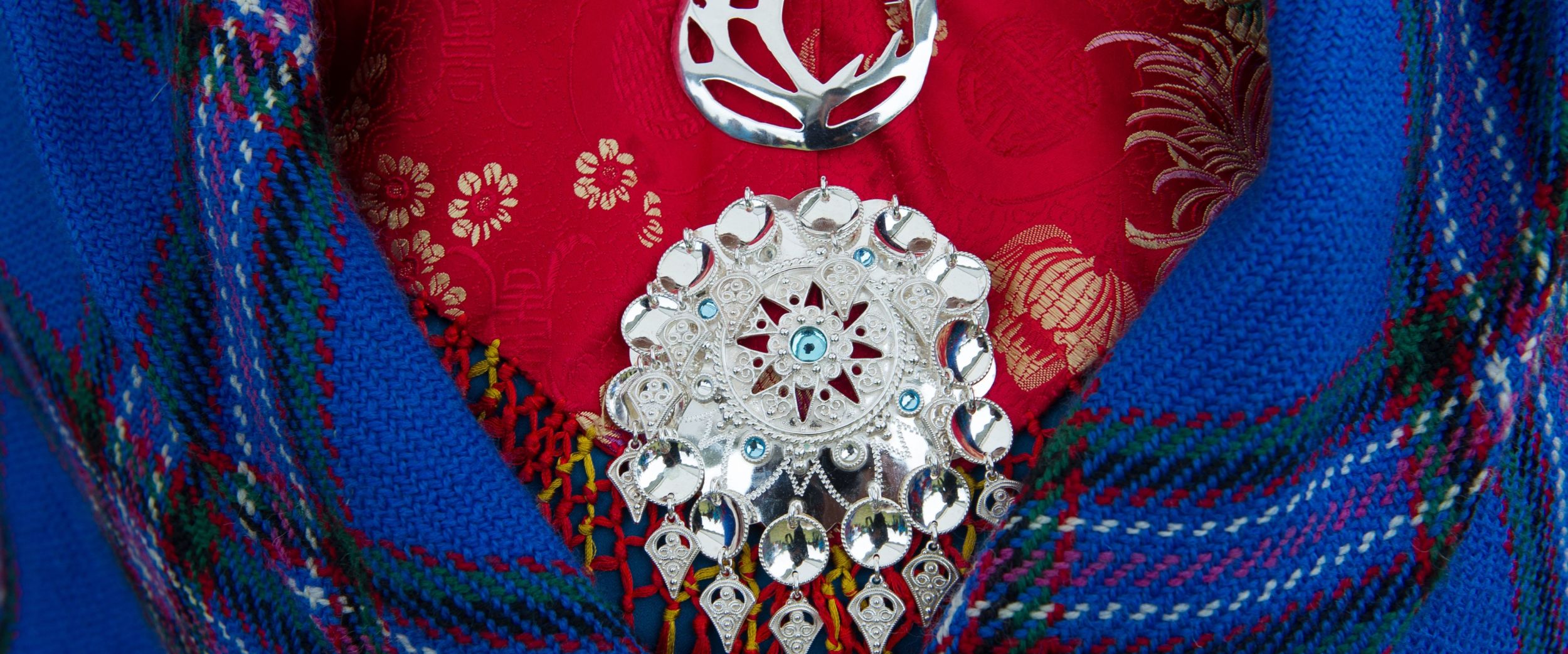 A sami brooch on traditional sami clothings. 