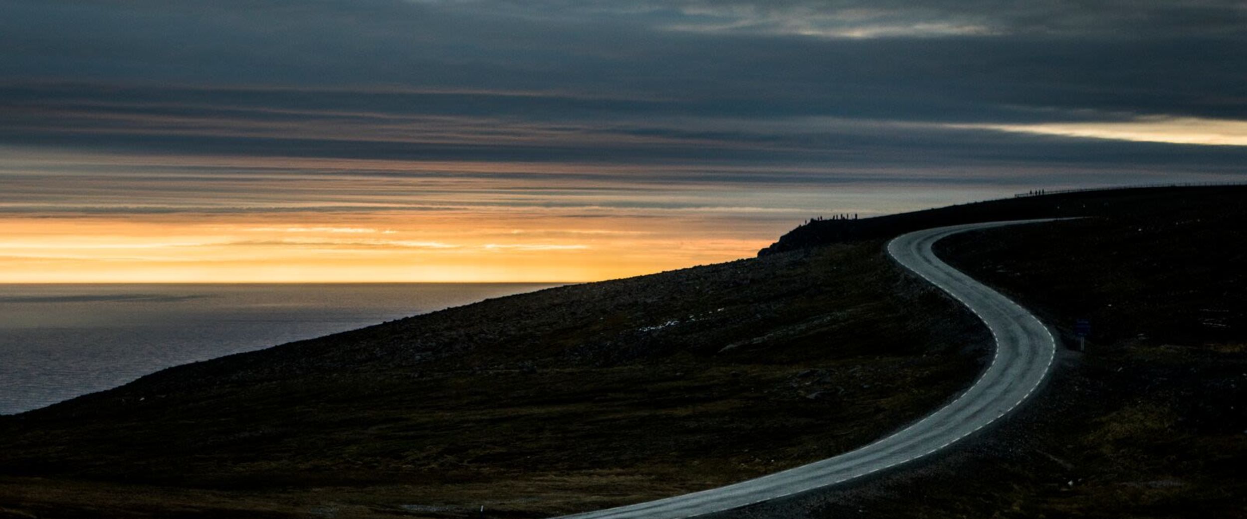 The road to North Cape in the midnight sun. Photo: Christian Roth Christensen, visitnorway.com