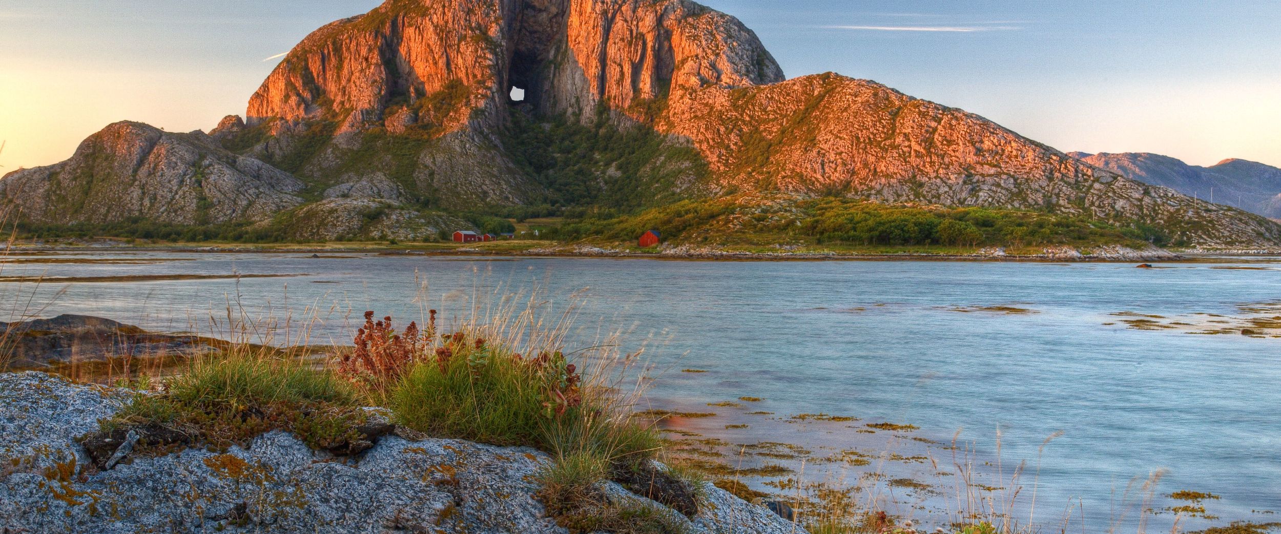 Torghatten mountain with a whole seen in sunset. 