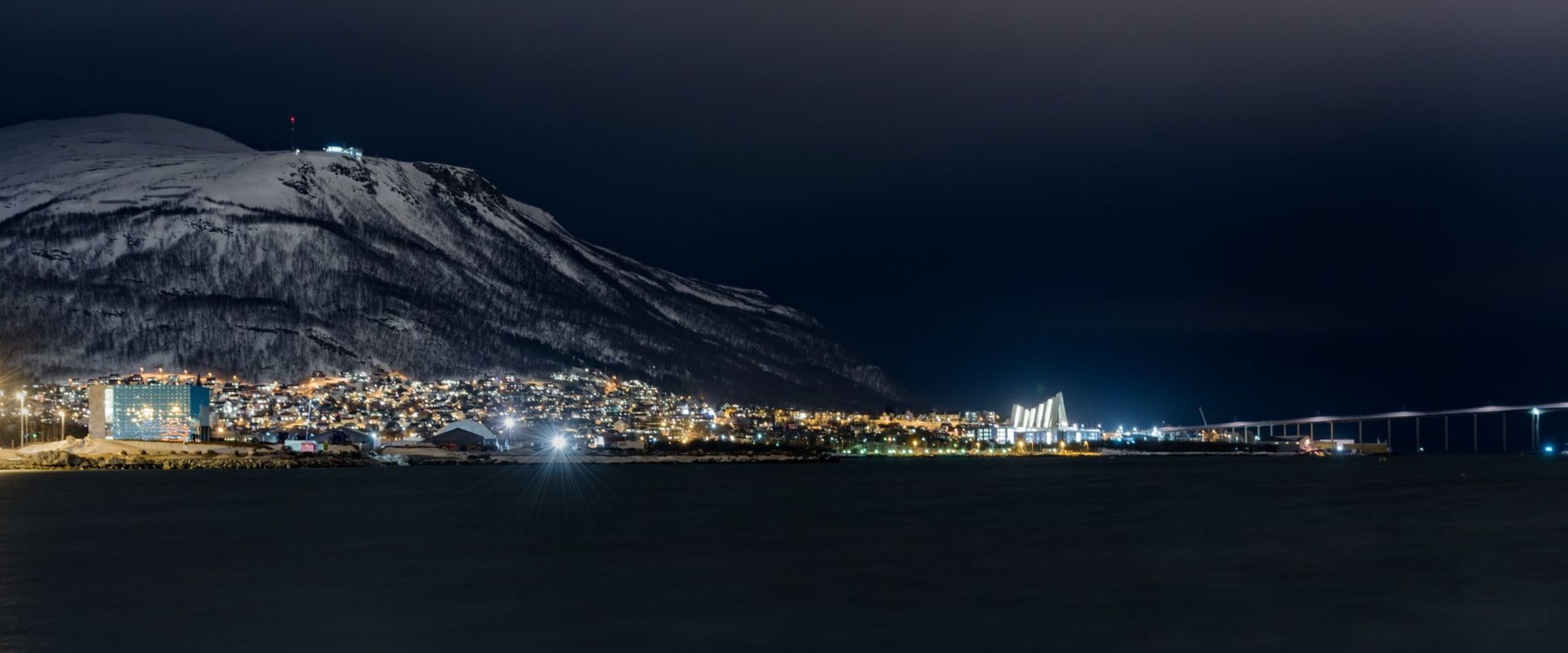 Tromsø in the night with Ishavskatedralen. Photo: Ludovic Charlet, Unsplash