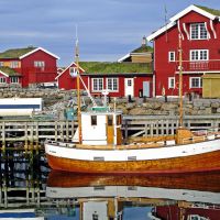 Red seahouses with grass roofs on Håholmen near Kristiansund