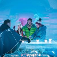 People enjoying cold drinks at an Ice hotell near Tromsø