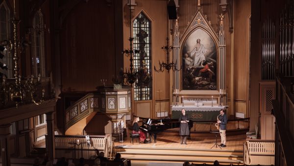 Midnight concert in the Tromsø Cathedral in Norway, woman singing