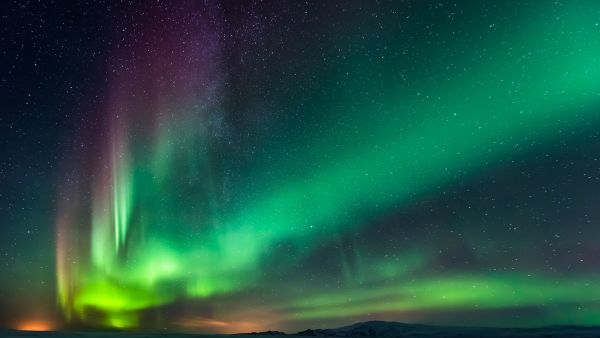 Northern lights - aurora borealis in purple, pink and green
