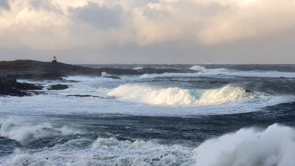 Big waves and a small lighthouse