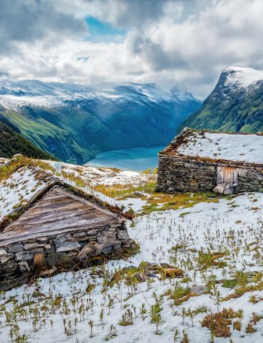 snow cabins above Geiranger