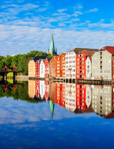 colorful buildings of trondheim reflected in the nidelva river