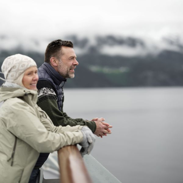 guests viewing the fjords in Norway from the ship