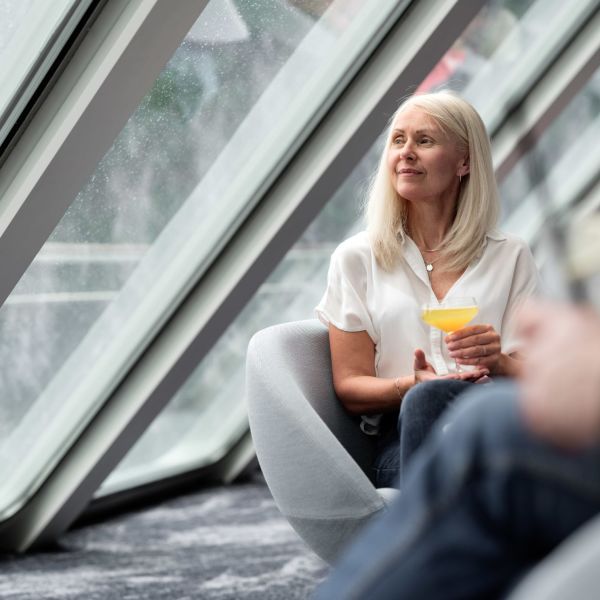 Woman enjoying the view in Havblikk Bar and Lounge