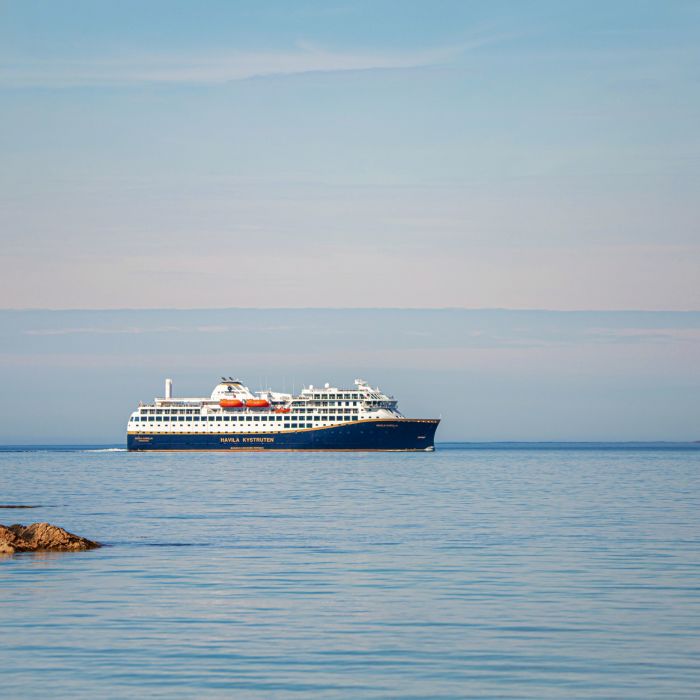 Havila Voyages ship on the ocean horizon 