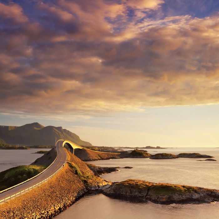 The Atlantic Road, beautifully coloured by the sunset. Photo: Jacek rózycki, visitnorway.com