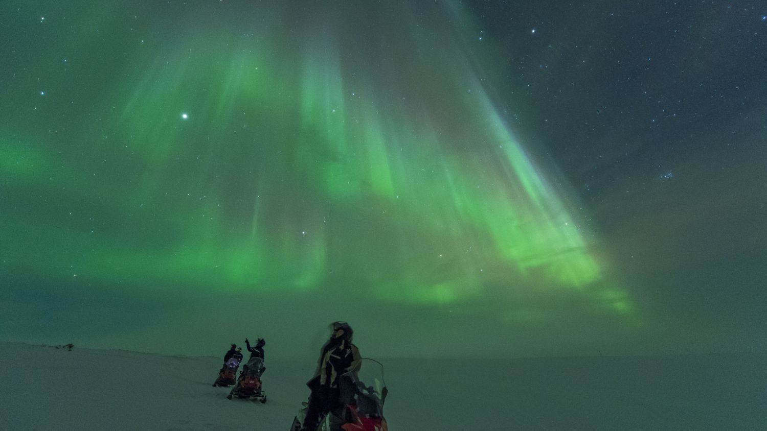 Snowmobiling in the polar night. Photo: Ørjan Bertelsen.