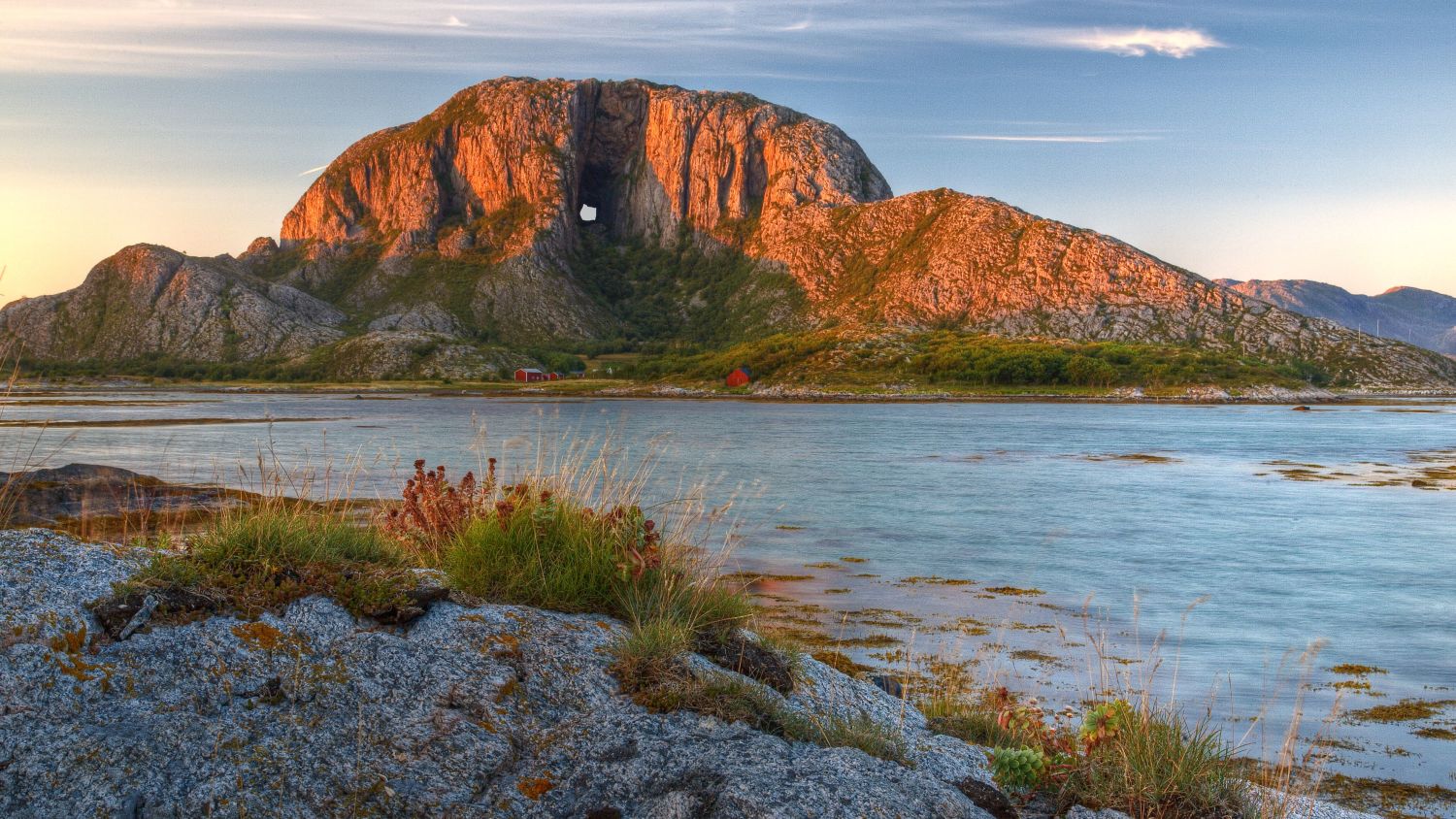 Torghatten mountain with a whole seen in sunset. 