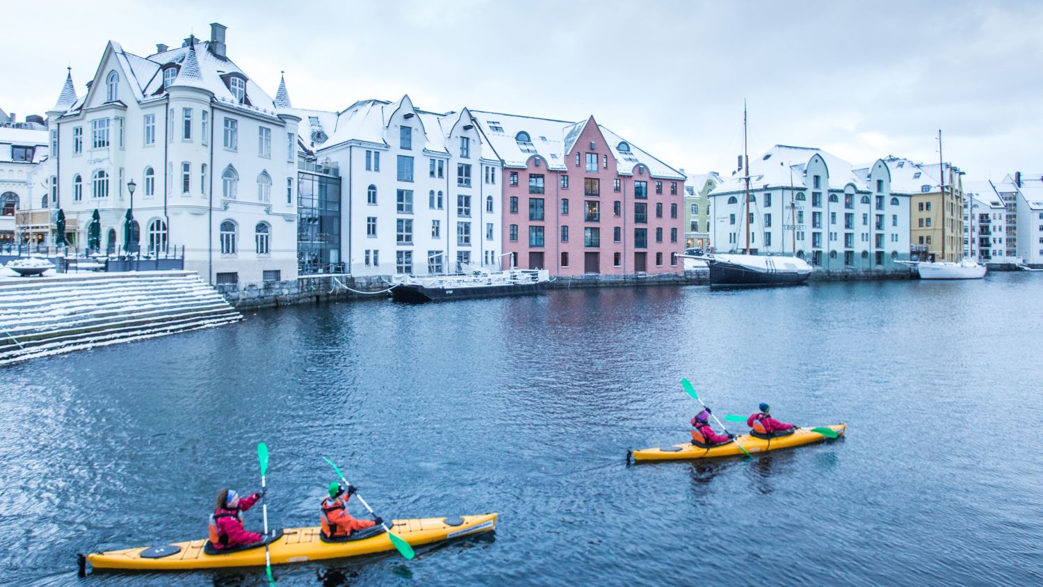 Kayaking in Brosundet in Ålesund in the winter. 