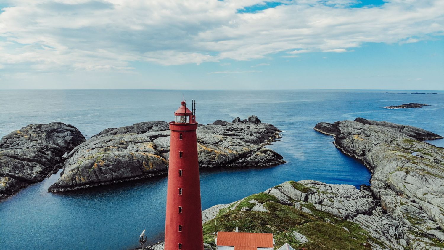 Aerial view of the red and beautiful Utvær lighthouse. Photo Lillian Herland.