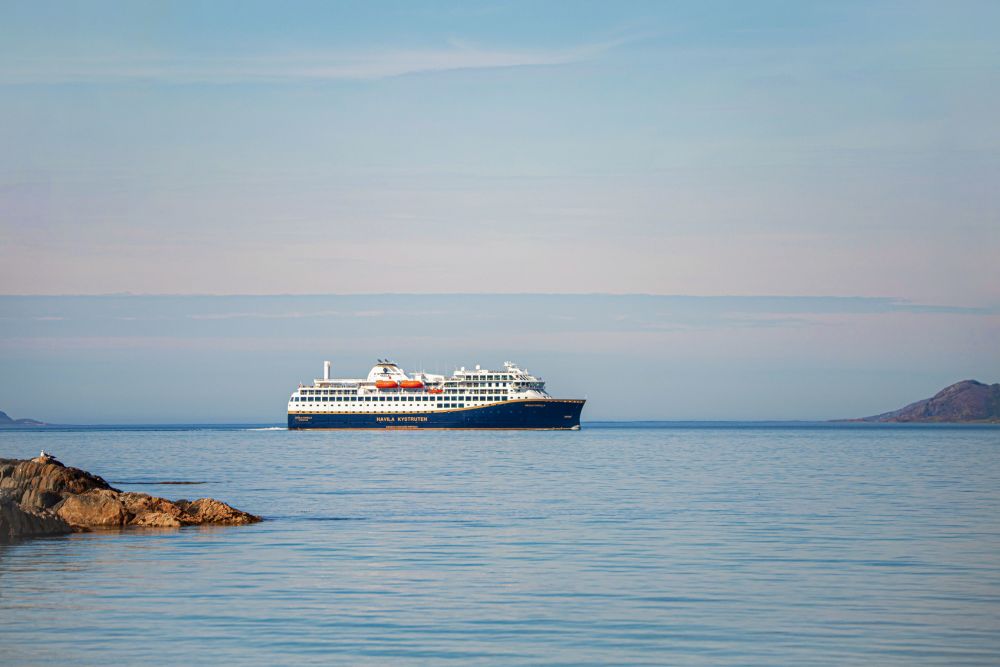 Havila Voyages ship on the ocean horizon 