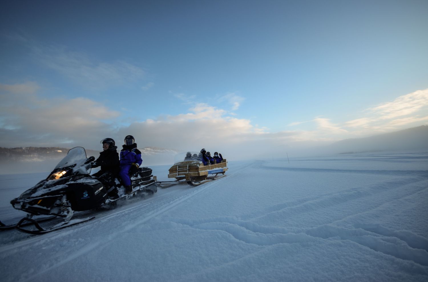 Snowmobiling a winter day in Kirkenes.