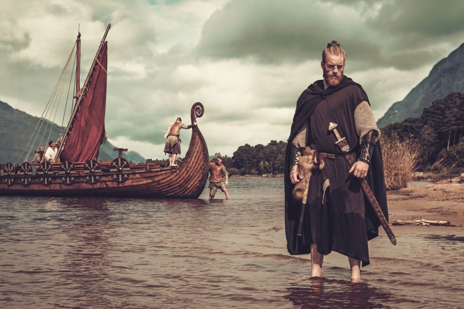 Viking and viking ship near Drakkar. 