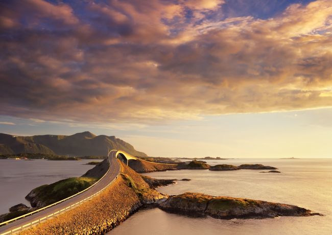 The Atlantic Road, beautifully coloured by the sunset. Photo: Jacek rózycki, visitnorway.com