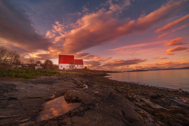 a medial church nearby the ocean