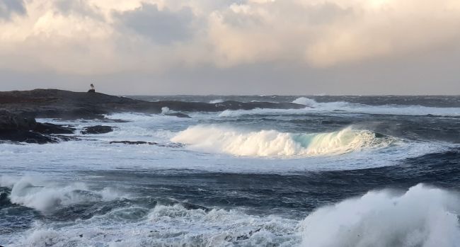 Big waves and a small lighthouse