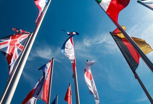 Flags from different nations. Photo: Unsplash