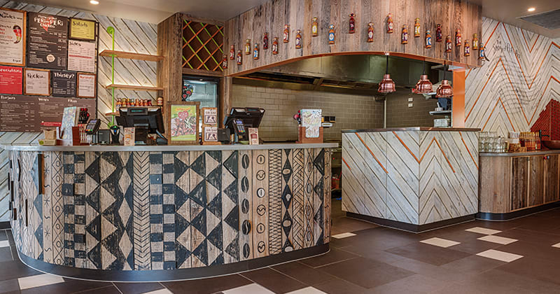 Nandos Brisbane, Australia selects Havwoods RECM2025 Reclaimed Barn Oak to feature on counters and walls