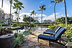 Beach Villas at Ko Olina O-1402 - Line up on a lounger by the pool, greenery closing it in.