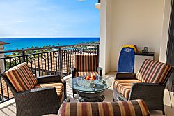 Beach Villas at Ko Olina O-1402 - A balcony set against a stunning ocean view, ready for relaxation or a meal.