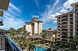Beach Villas at Ko Olina O-521 - A view of palm trees and the aqua blue pool from the lanai.
