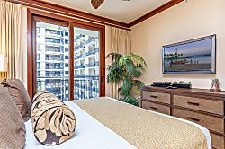 Beach Villas at Ko Olina O-521 - The primary bedroom also offers extra storage and TV.